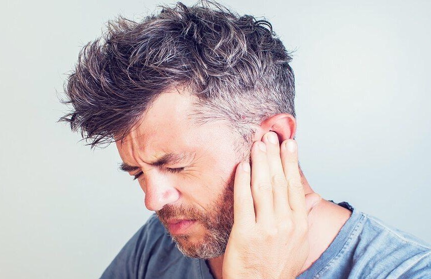 Man experiencing tinnitus and ear ringing relief presentation